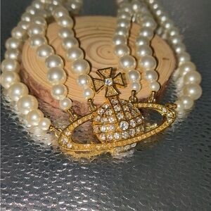 Vivienne Westwood Triple-Layer Pearl Necklace with Gold Saturn Pendant